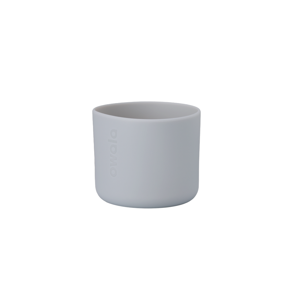 Owala Bottle Boot in soft light gray silicone with tonal Owala logo, short cylindrical form sized for 16oz Kids' FreeSip bottles